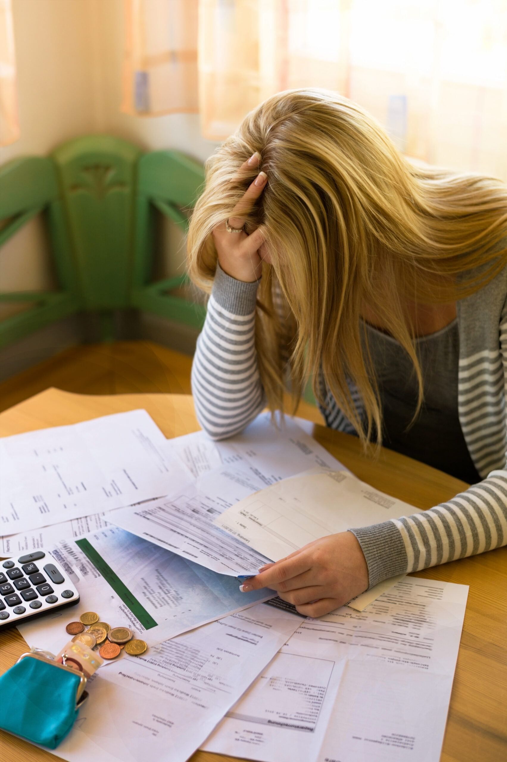 woman with debts and bills